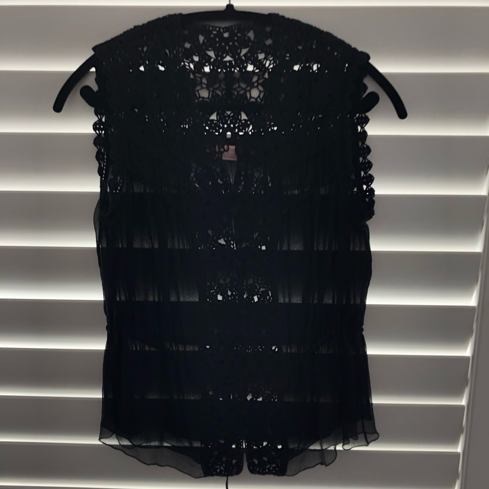 Sheer sleeveless BCBG top. Crochet. Sheer. Great condition. Non Smoker.